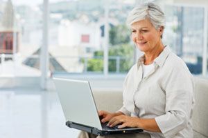 Middle aged woman shopping from Canadian pharmacy website